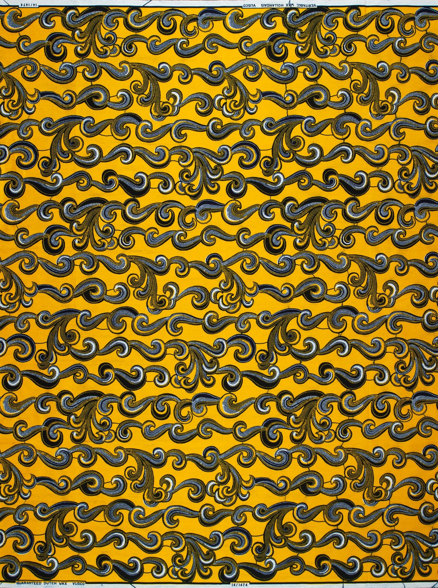 Yellow Wax Hollandais fabric with swirling patterns, ideal for vibrant African fabric designs