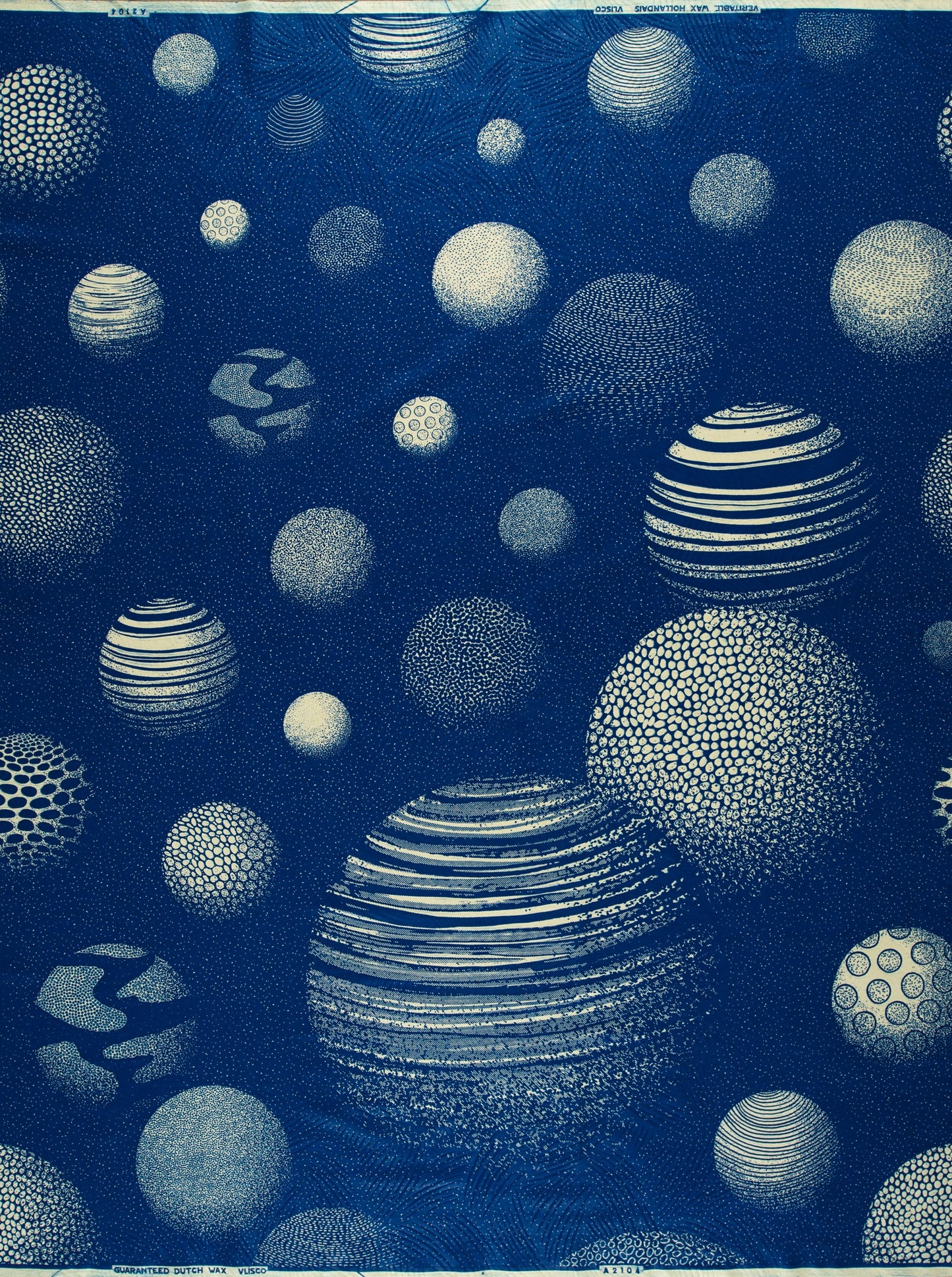 Cyanotype-printed spherical pattern on Wax Hollandais fabric, ideal for African fabric designs