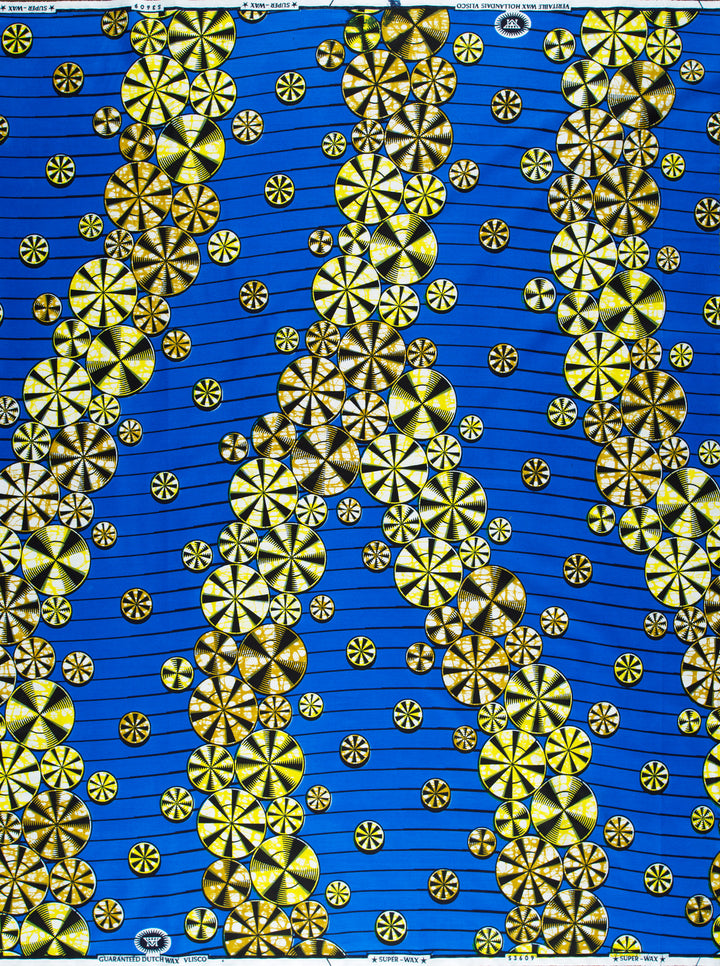 Blue fabric with yellow circular patterns showcasing expressive design in Super-Wax VLS3609.009